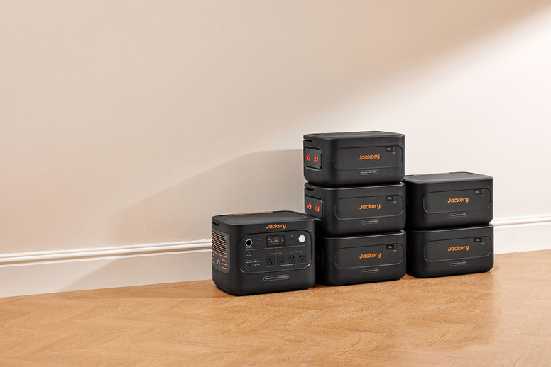 Jackery portable power stations and expansion batteries arranged on a wooden floor